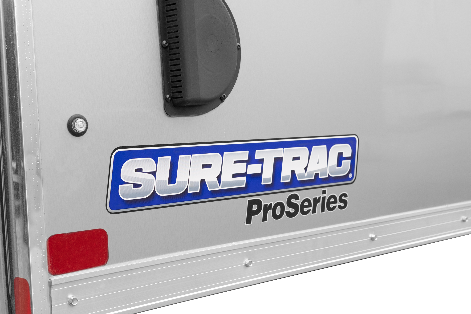 Sure-Trac | Pro Series Round Top Enclosed Cargo Trailer | Image | Side, tilted, gray, Pro Series Round Top Enclosed Cargo trailer, close-up of Flow-Through Scoop Vent