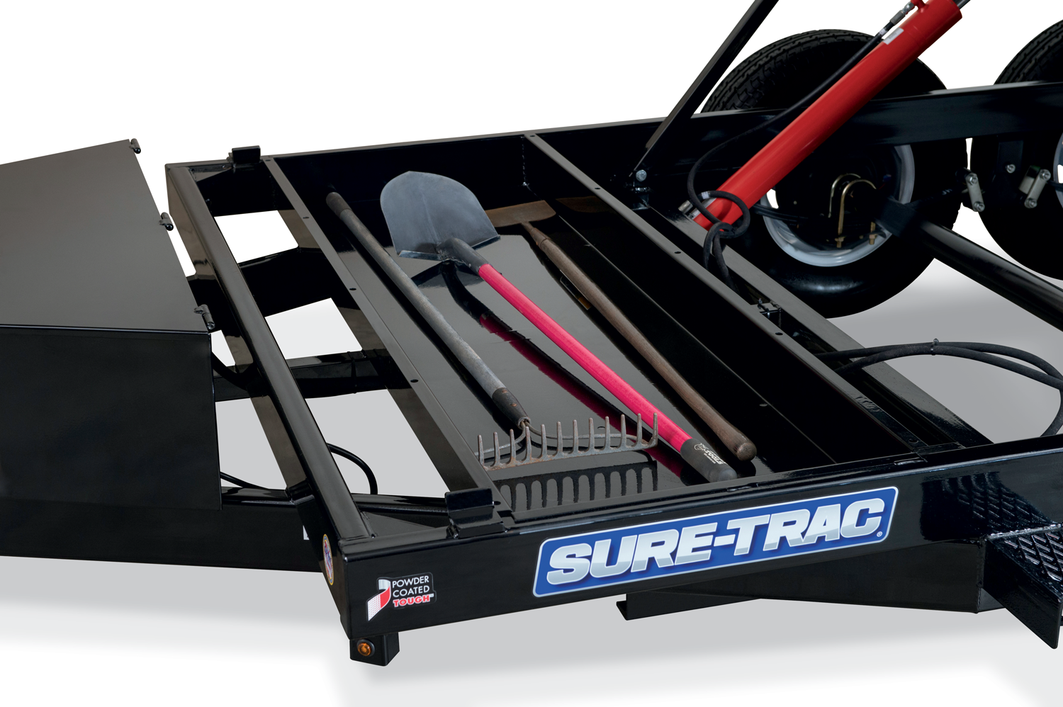 Sure-Trac | Image | Close-Up of the underbody Tool Storage Tray with a shovel and rake in it