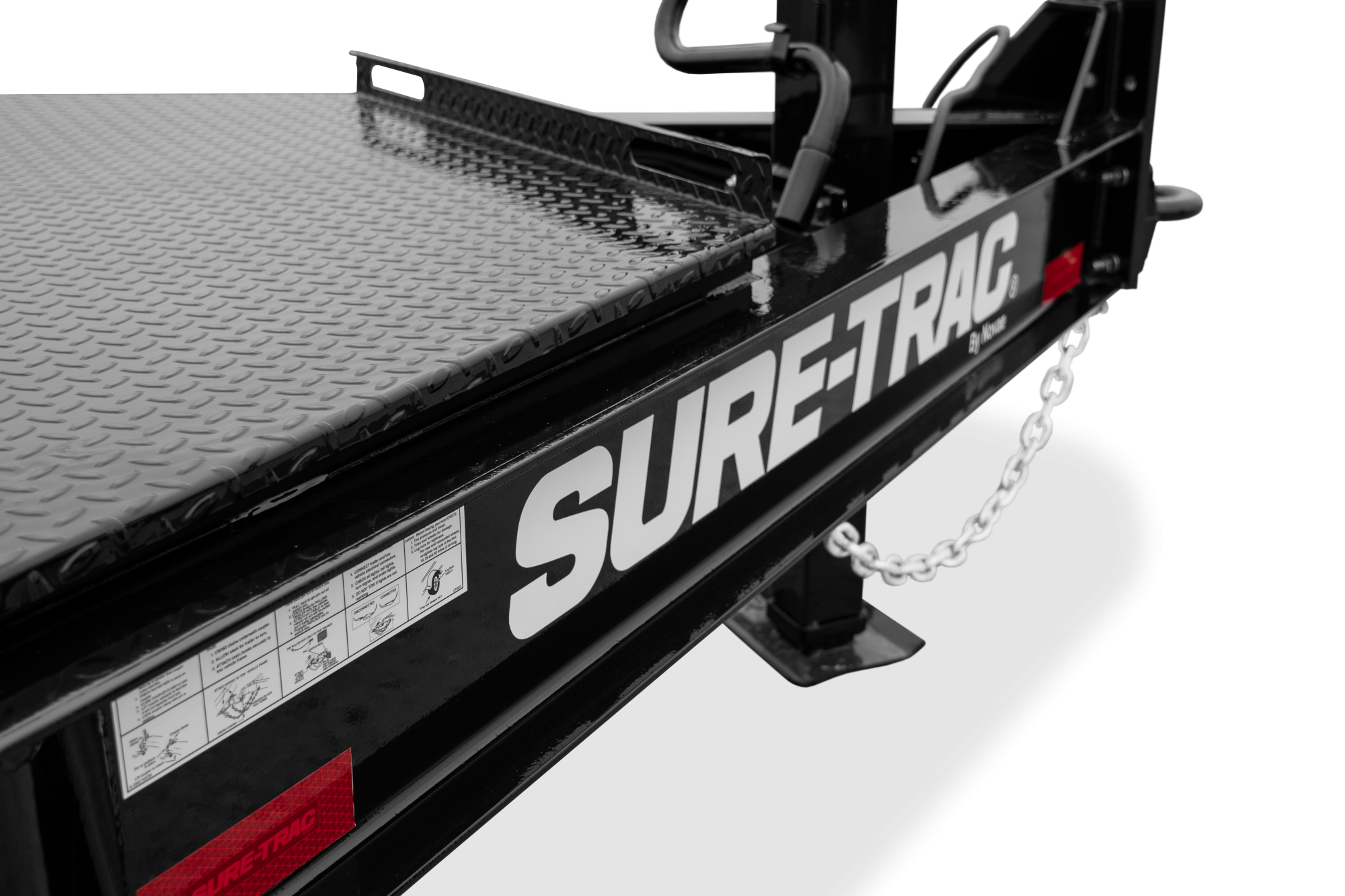 Sure-Trac | Pro Series Tilt Bed Trailer | Image | Side, tilted, Pro Series Tilt Bed Trailer with reflective tape, close-up of IBEAM, large toolbox