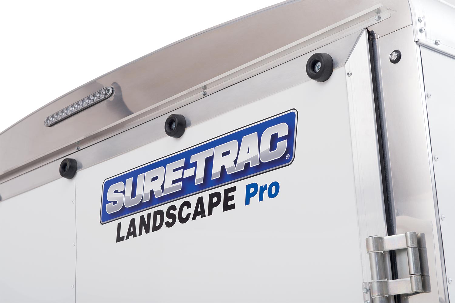 zoomed in view of the sure-trac logo on the landscape pro round top enclosed trailer
