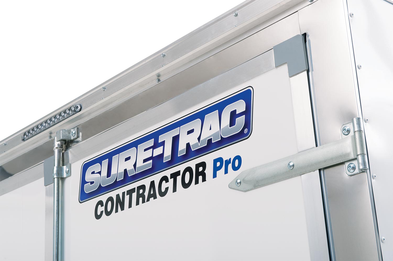 zoomed in view of the Sure-Trac logo on the contractor pro bullnose enclosed cargo trailer