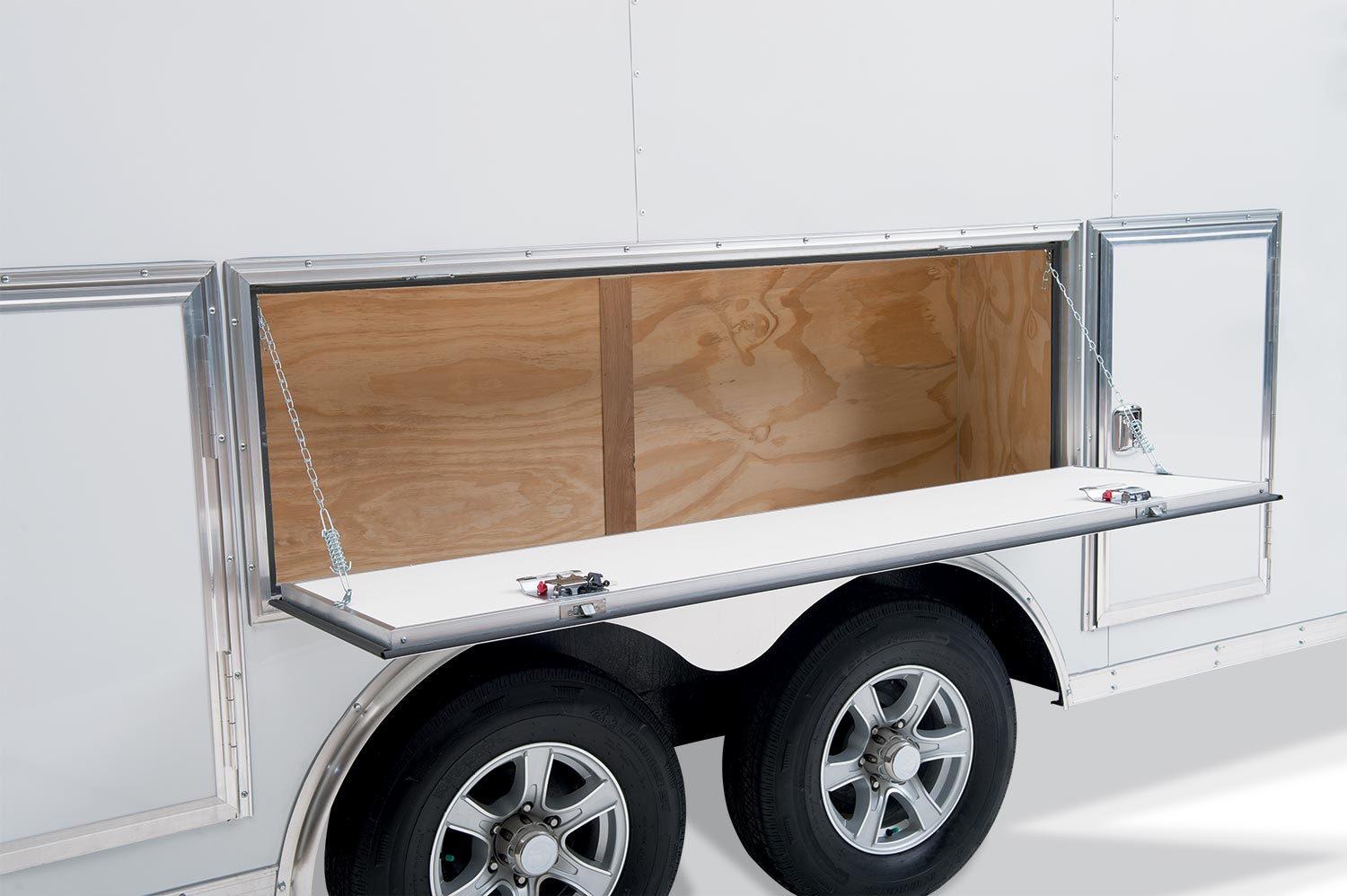 view of the side of the contractor pro bullnose enclosed cargo trailer with the side down