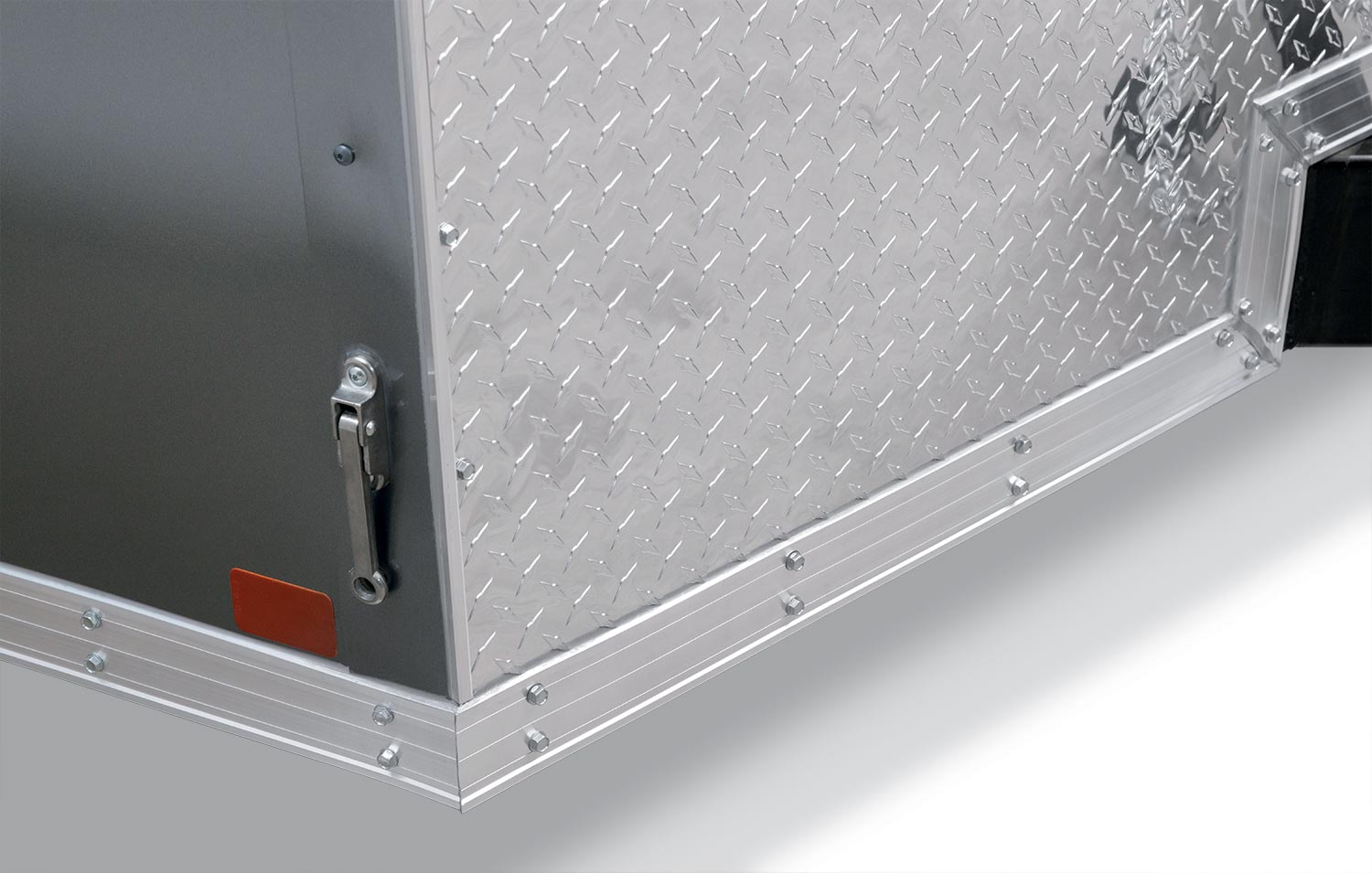 zoomed in view of the aluminum door on the pro series round top enclosed car hauler trailer