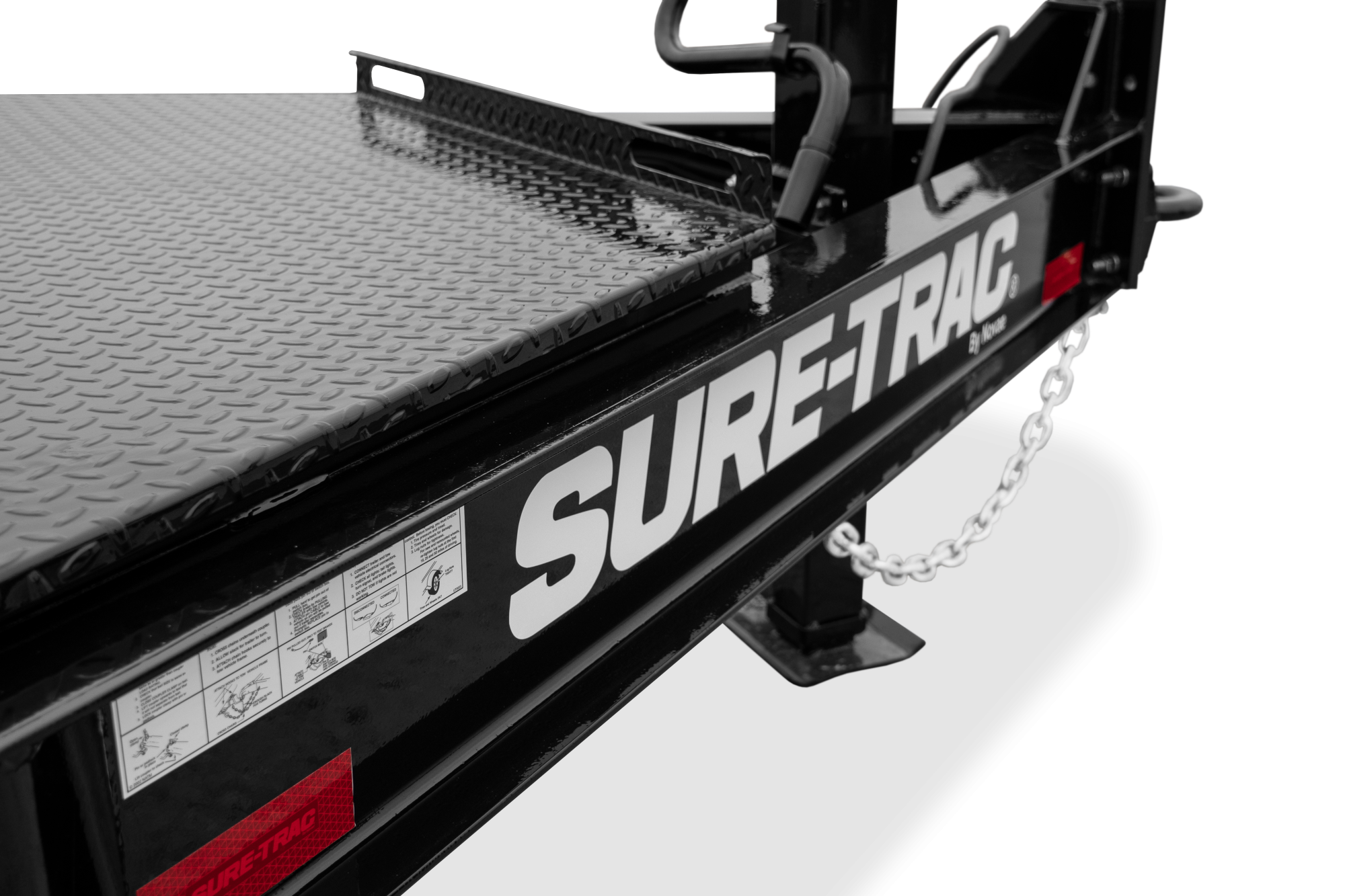 Pro Series Tilt Bed Trailer | Side, tilted, Trailer with reflective tape, close-up of IBEAM, large toolbox