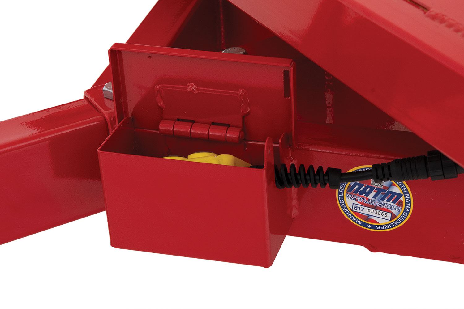 protected remote holder on the utility dump trailer