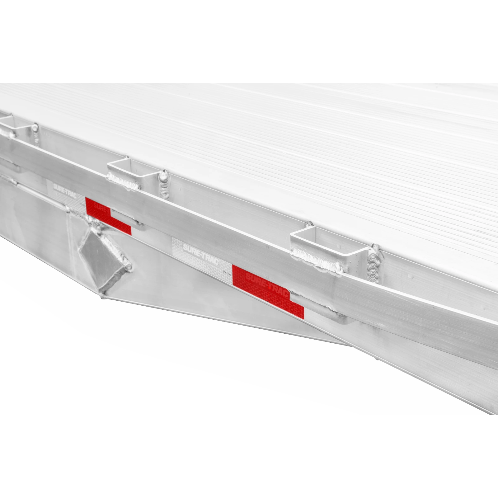 Side view of a silver aluminum freight trailer with red reflective tape along the lower edge.