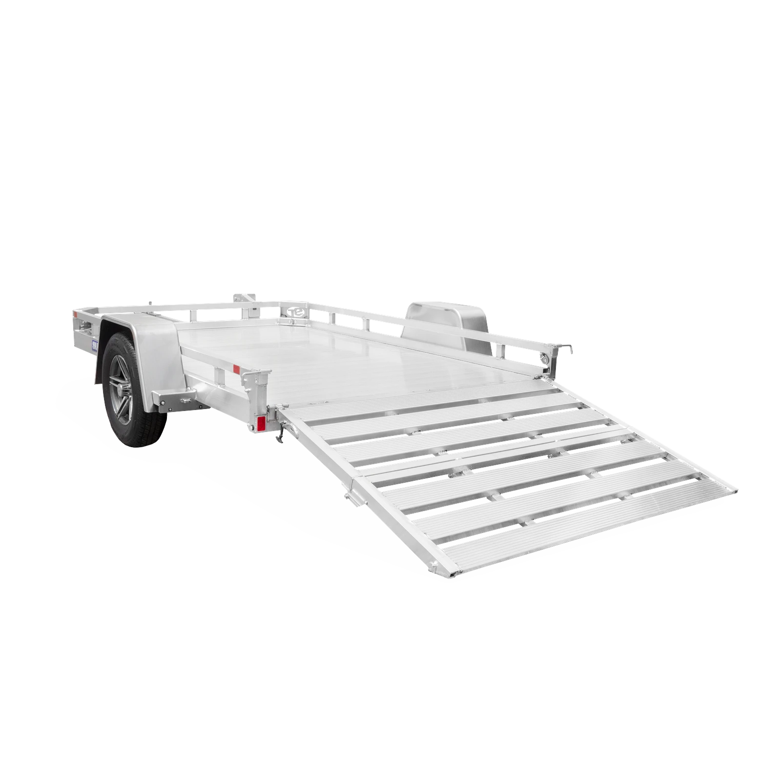 Aluminum equipment trailer with a long loading ramp extending outward, shown from a low left angle.