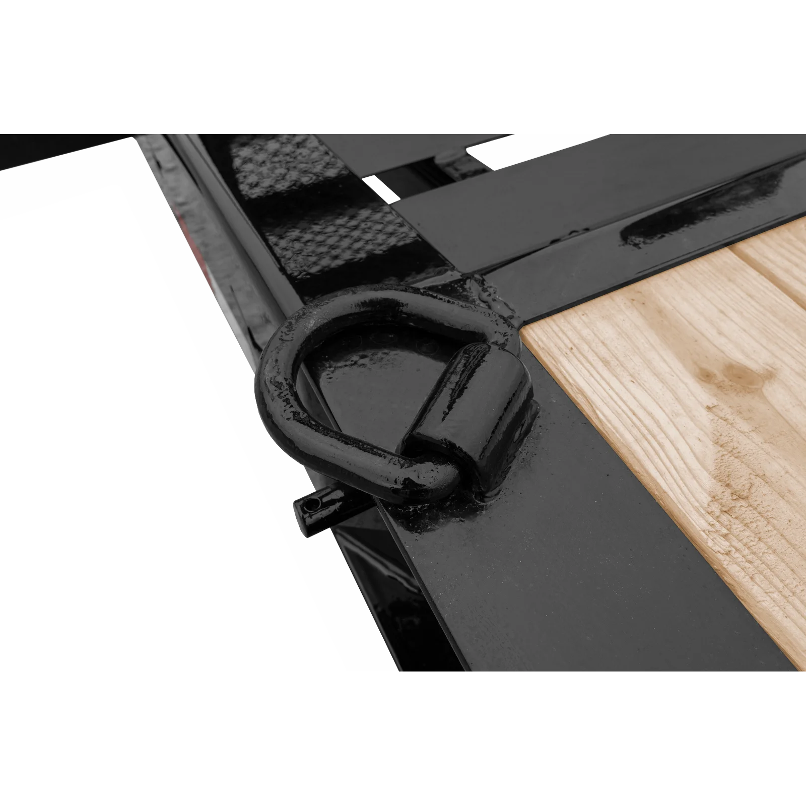 Close-up of a black metal hinge or clamp gripping a light wooden plank.