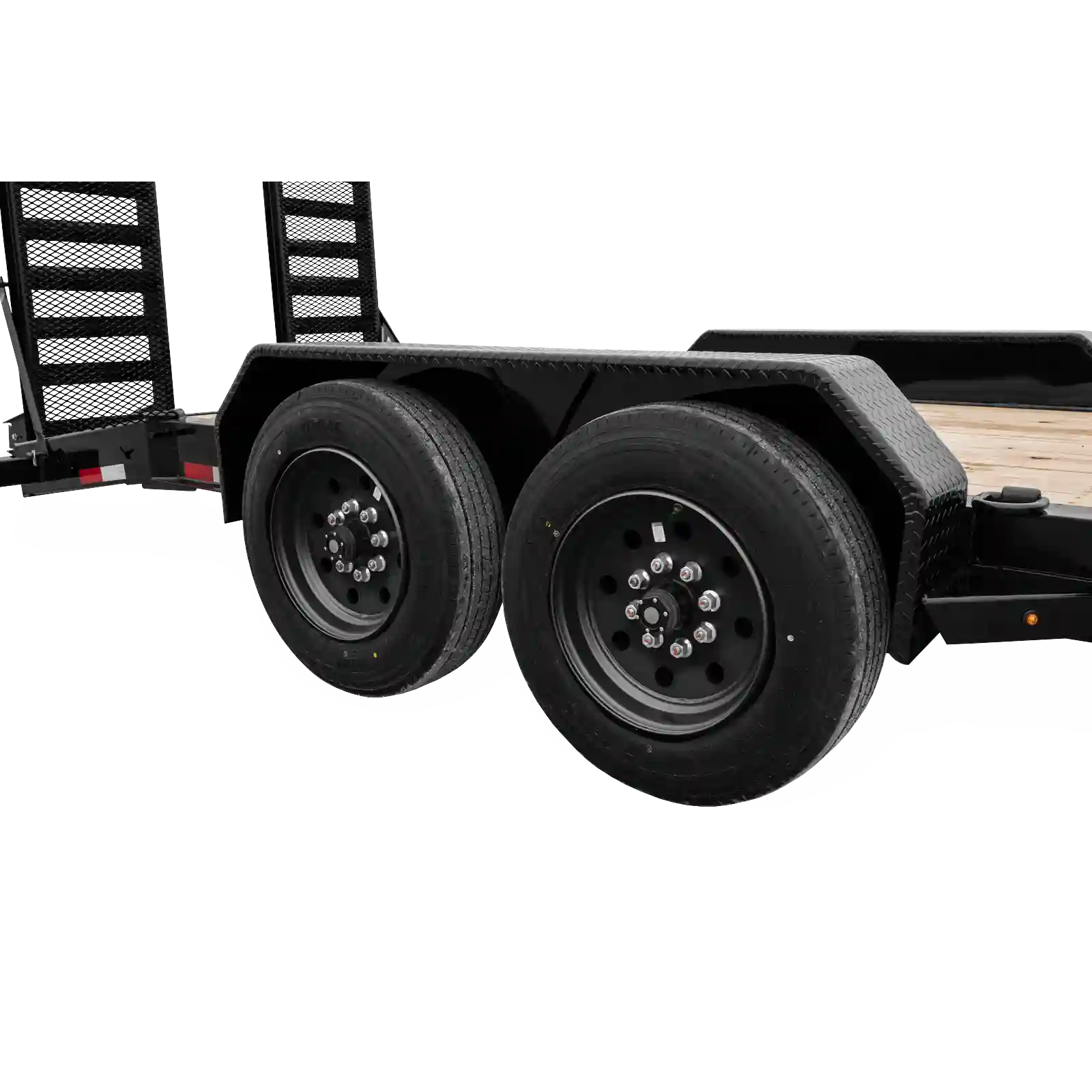 Close-up of a dual-axle trailer with black rims and diamond-plate fenders over the wheels, and a wooden deck.