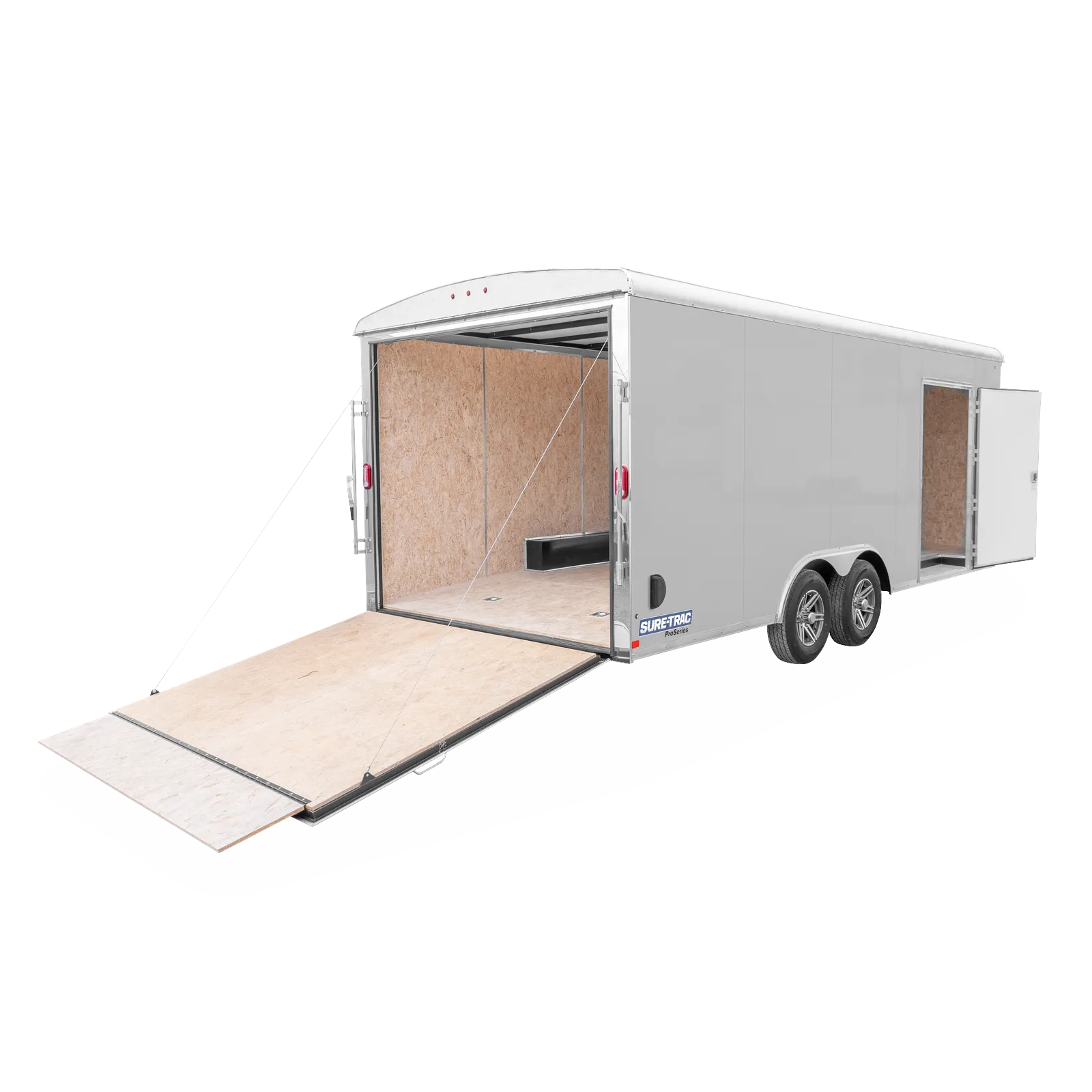 Enclosed cargo trailer with rear ramp lowered, showing plywood interior and tandem wheels (Sure-Trac Pro Series).