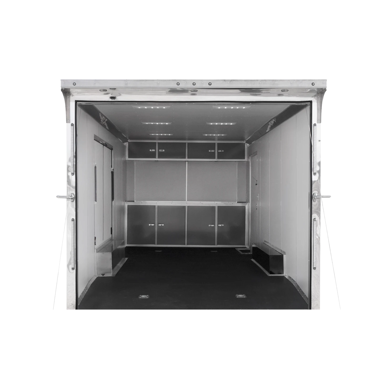 Open cargo trailer interior with metal walls and built-in wall cabinets along the sides